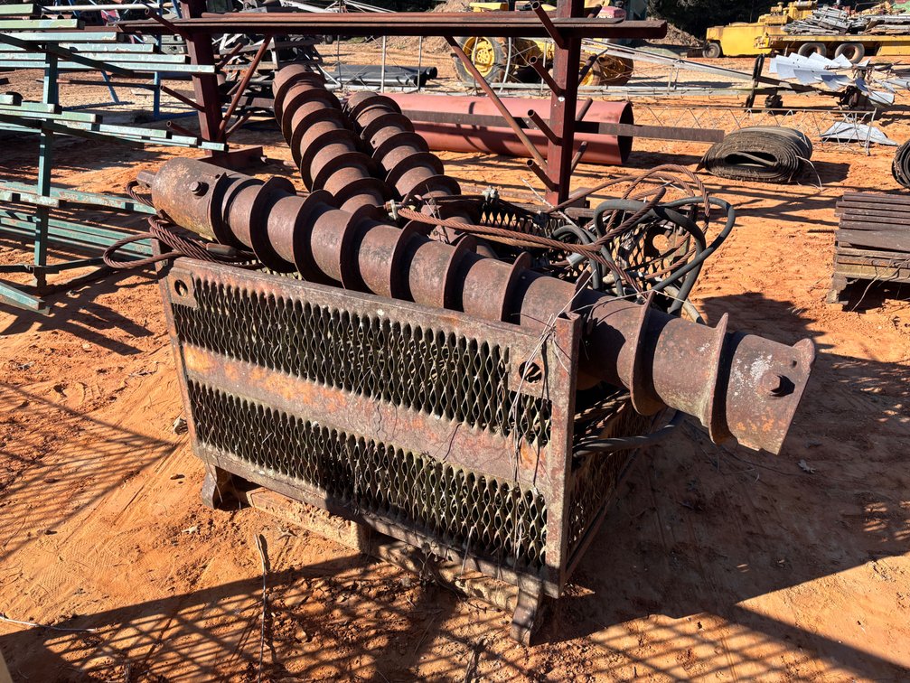 Steel Auger Sections, Wire Rope, and Hoses in Mesh Basket