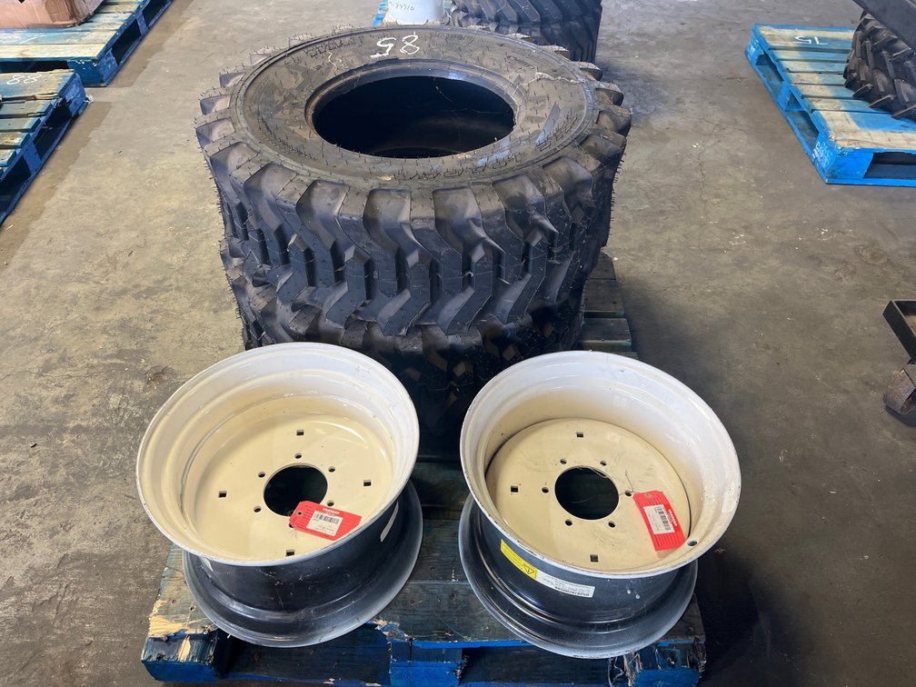 2 YANMAR RIMS AND TIRES