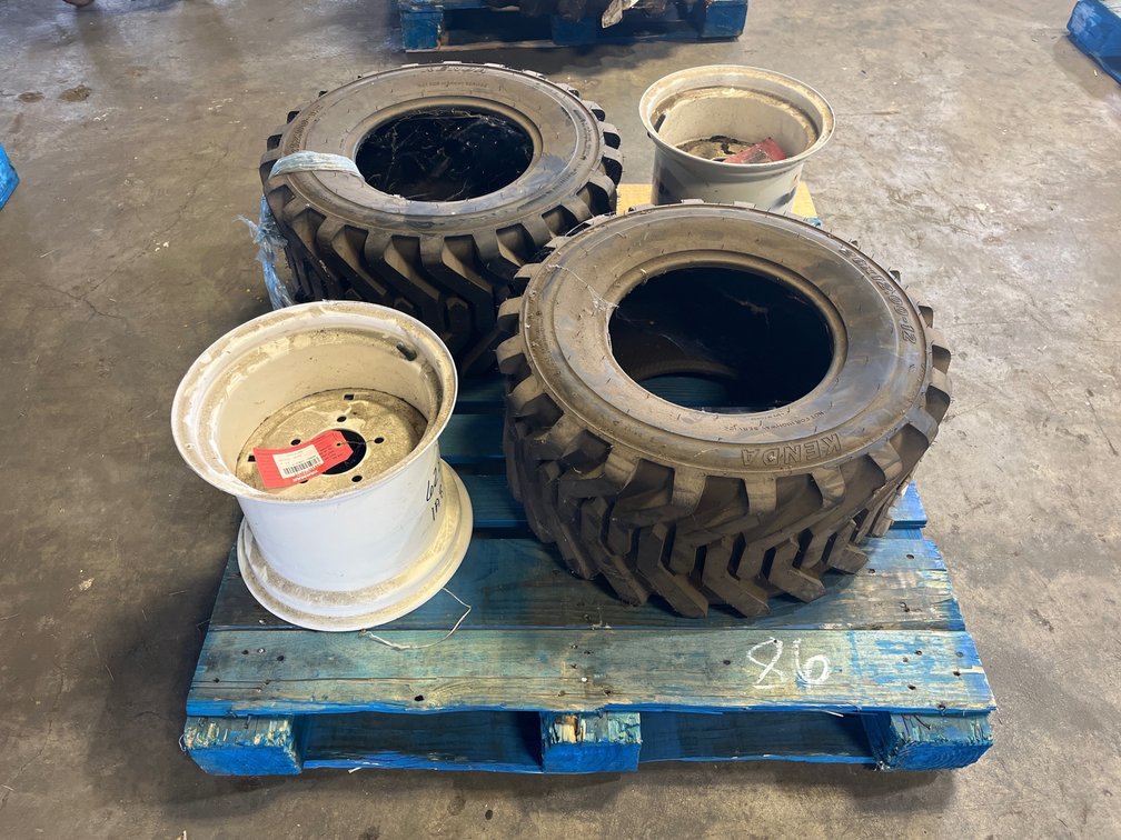 2 YANMAR TIRES AND RIMS 