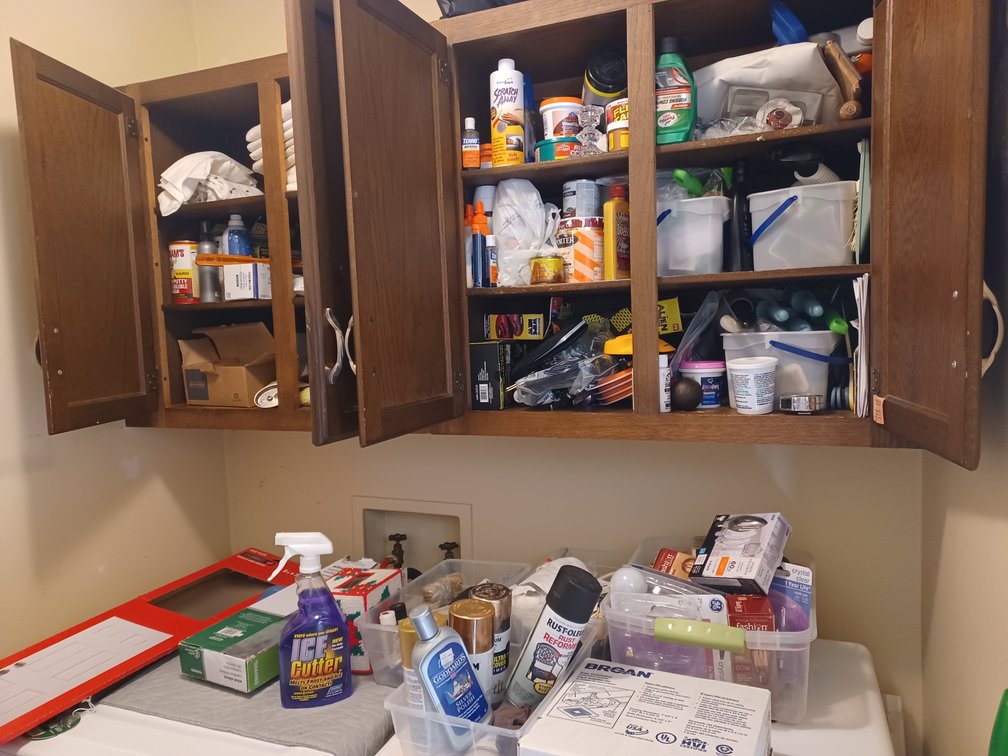 Laundry cabinet and shelf cleanout