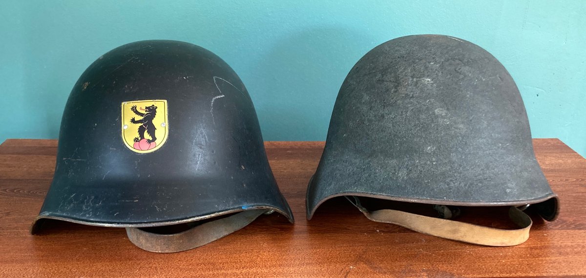 Authentic Swiss Model 1918 Combat Steel Helmets, One with Coat of Arms