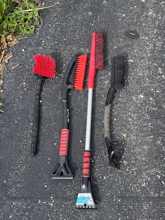 Vehicle ice scrapers with brushes