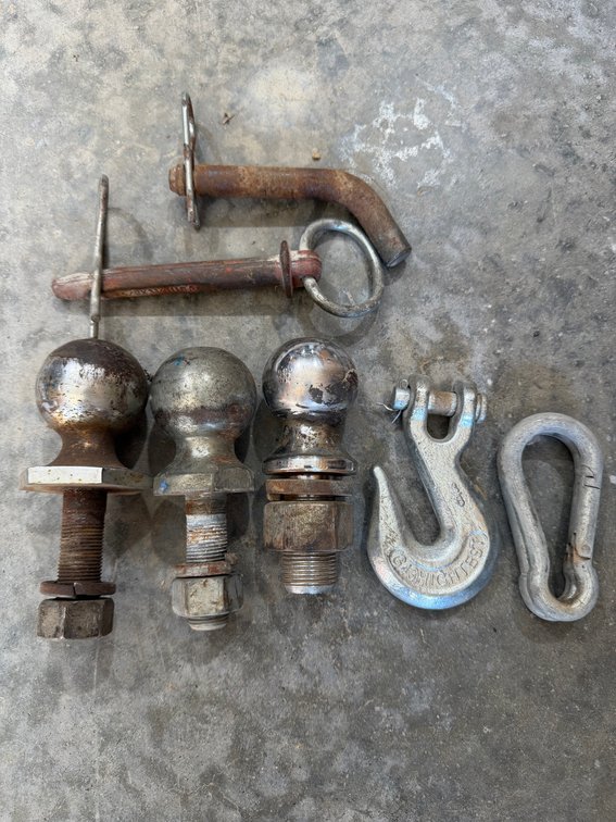 Lot of trailer balls, pins, and hook Two 2” and one 1 7/8”