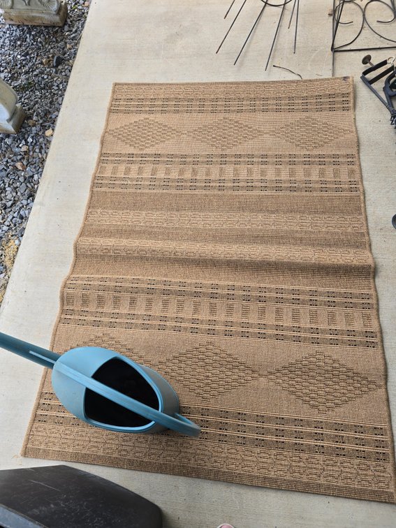 Grass porch rug abd water can