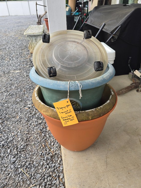 Three large planters, one saucer with wheels