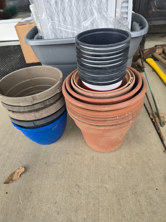 2 stacks mixed sizes plastic planter pots