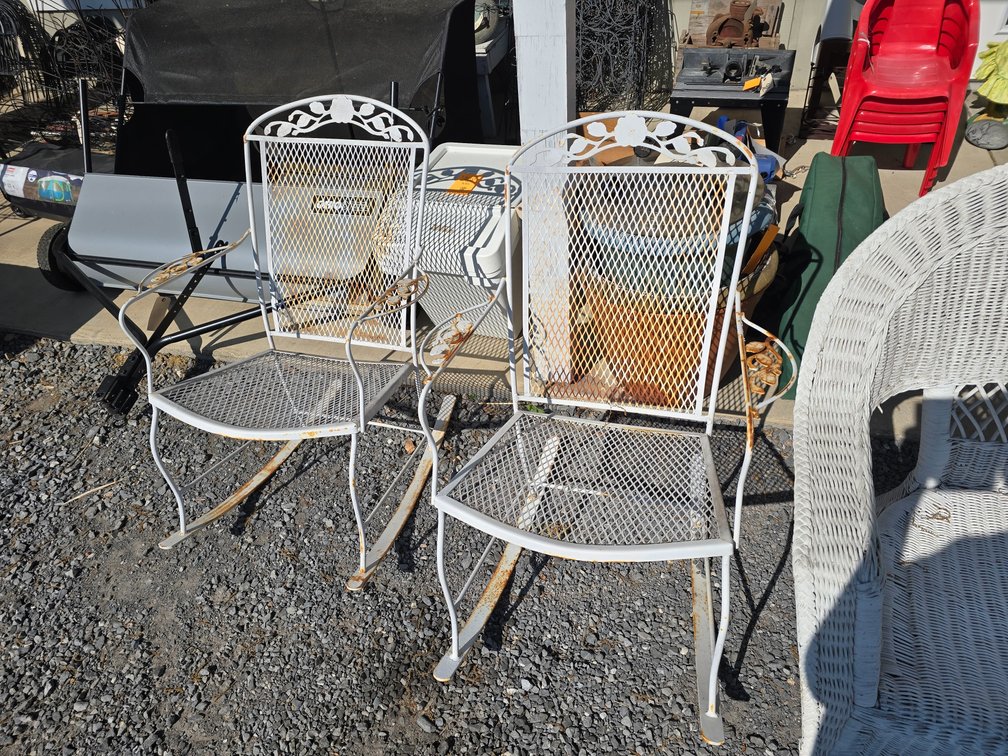 2 white cast iron porch chairs