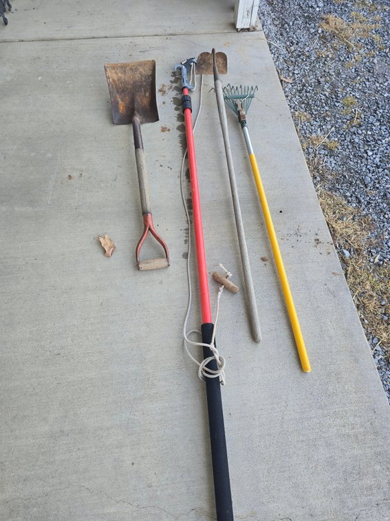 Pole saw, shovel, hoe and rake