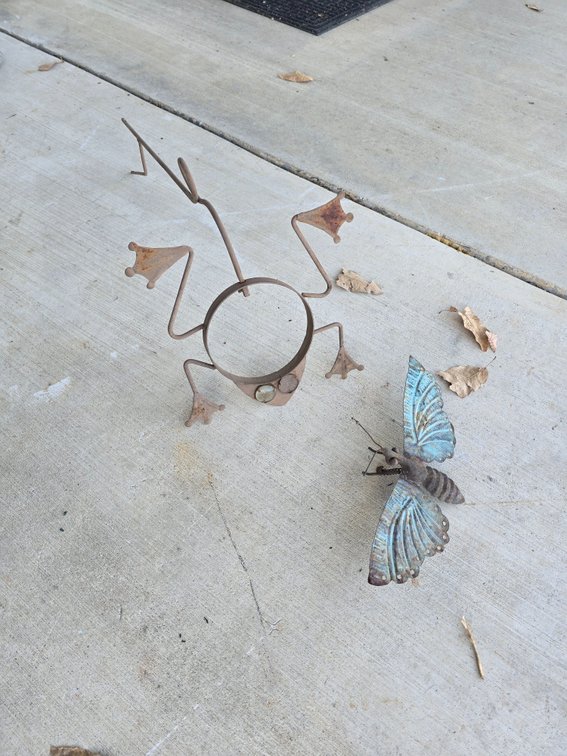 Frog and butterfly yard art