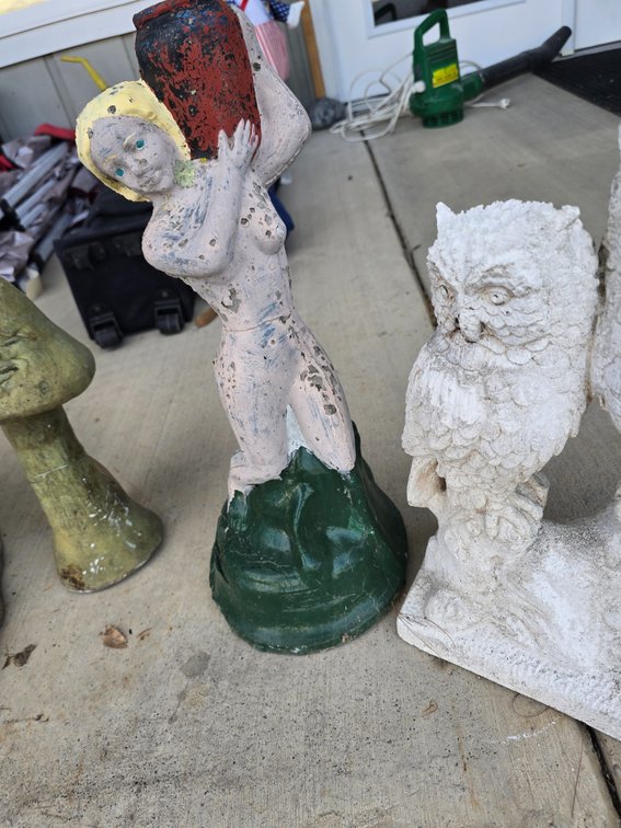 Concrete statue and a pair of owls