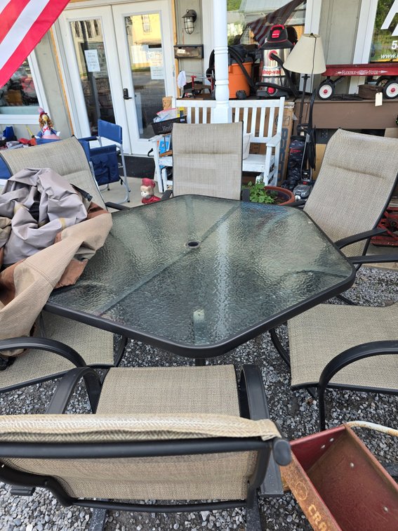 Glass top table with 6 super nice chairs and table cover