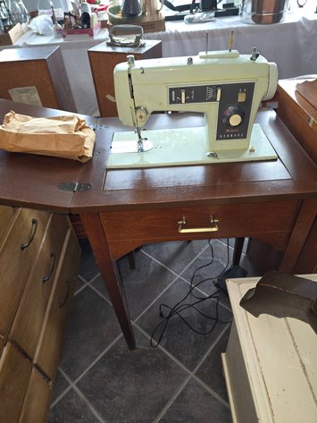 Image for 1970 Kenmore sewing machine either attachments in cabinet