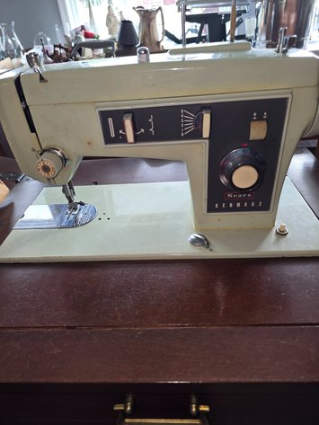 Image for 1970 Kenmore sewing machine either attachments in cabinet