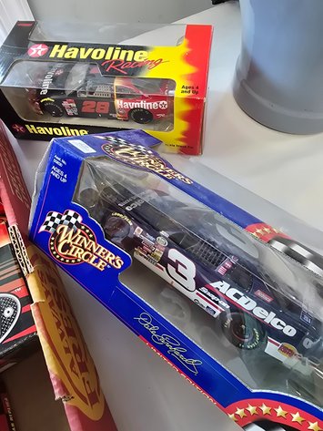 Image for 7 nascar cars and car haulers