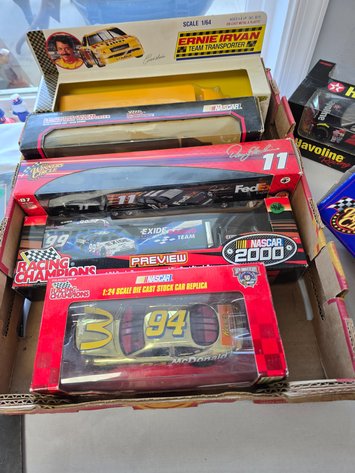 Image for 7 nascar cars and car haulers
