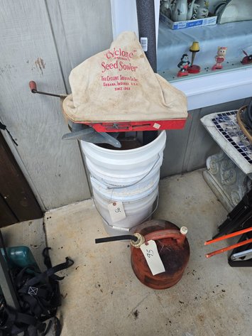 Image for Seed sower, buckets, and gas can