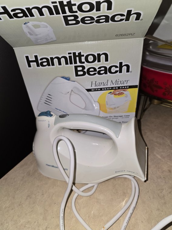 Two hand mixers with bowl rest