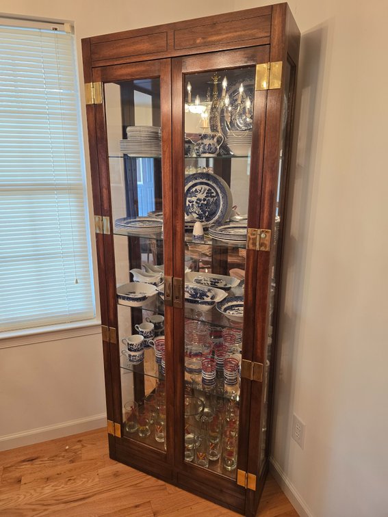 Display cabinet with glass shelves and brass finishes. Items NOT inc.
