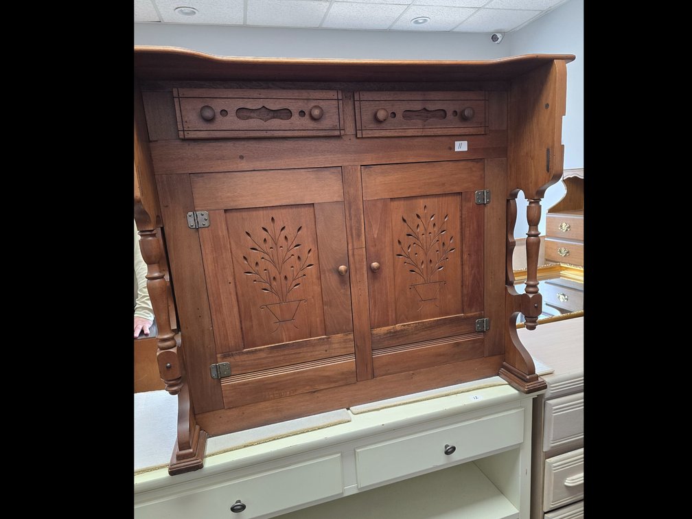 Primitive cabinet made and sculptured