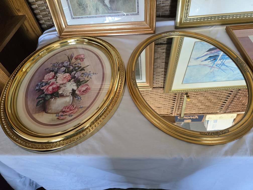 Oval mirror and floral print