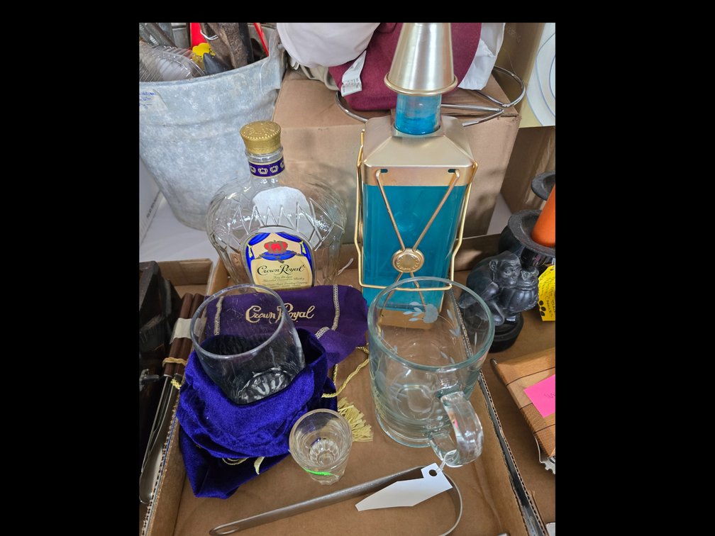Liqueur decanters, crown royal bottle and cover and crystal glasses