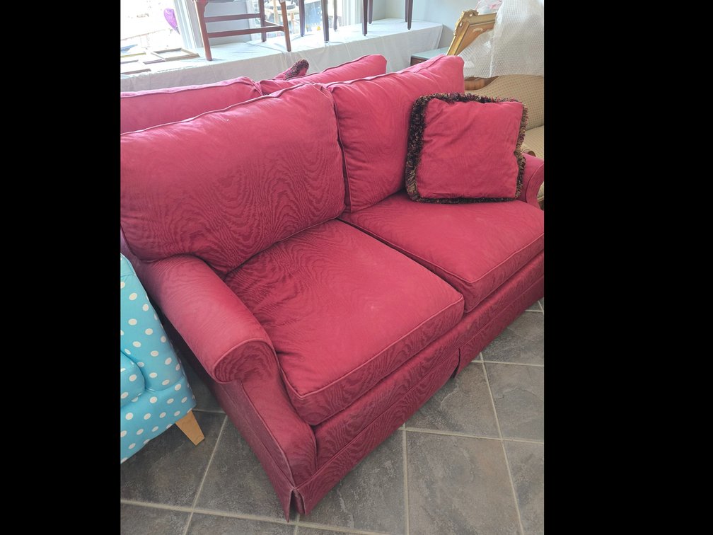Upholstered loveseat in burgundy excellent condition
