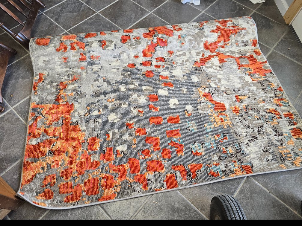 Area rug in orange and gray