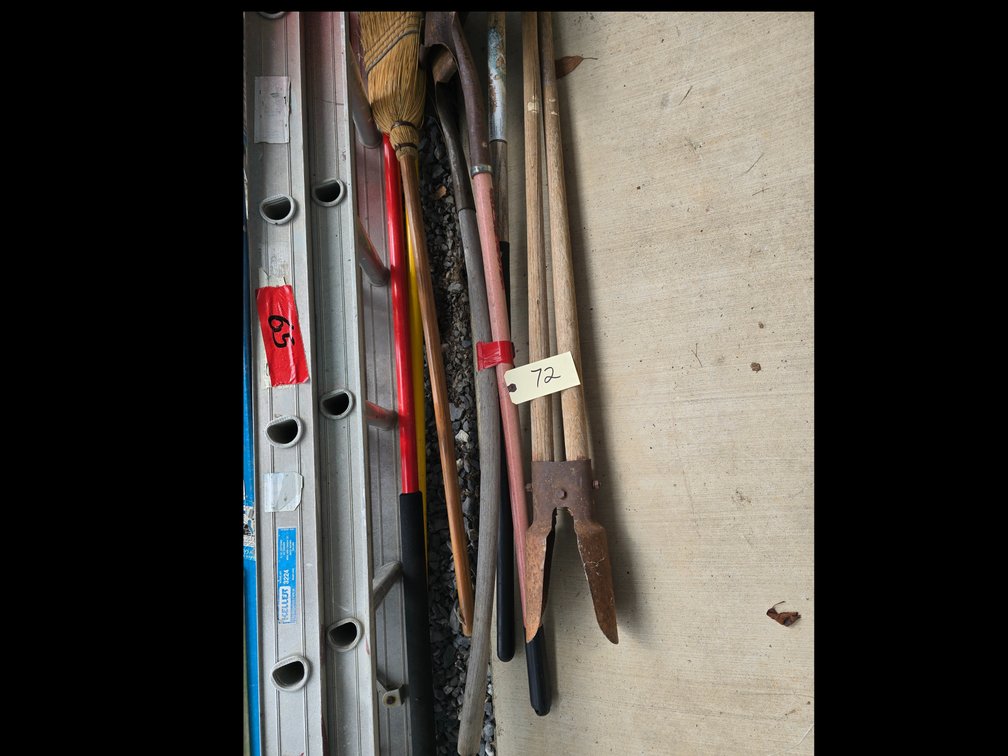 Two shovels, hoe. Post hole digger and broom