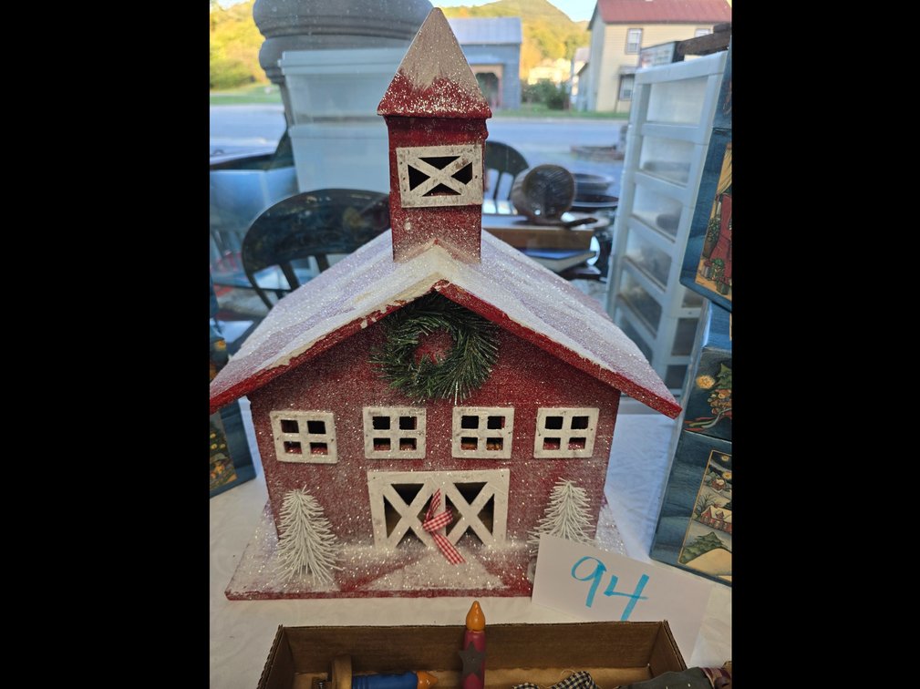 Handcrafted winter barn from tennessee, stacked boxes and many handcrafted christmas ornaments