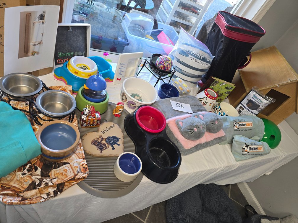 Pet items, cat foot warmer, lots of pet bowls, like new carrier. .Et cetera