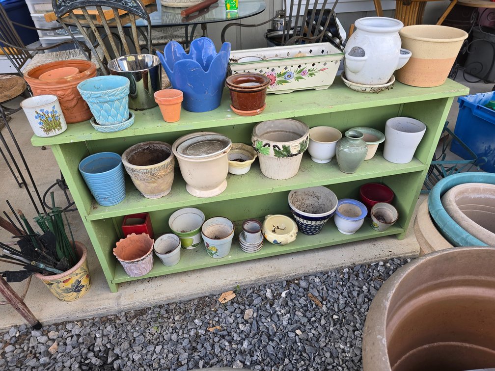 Primitive bench with all types of flower pots included