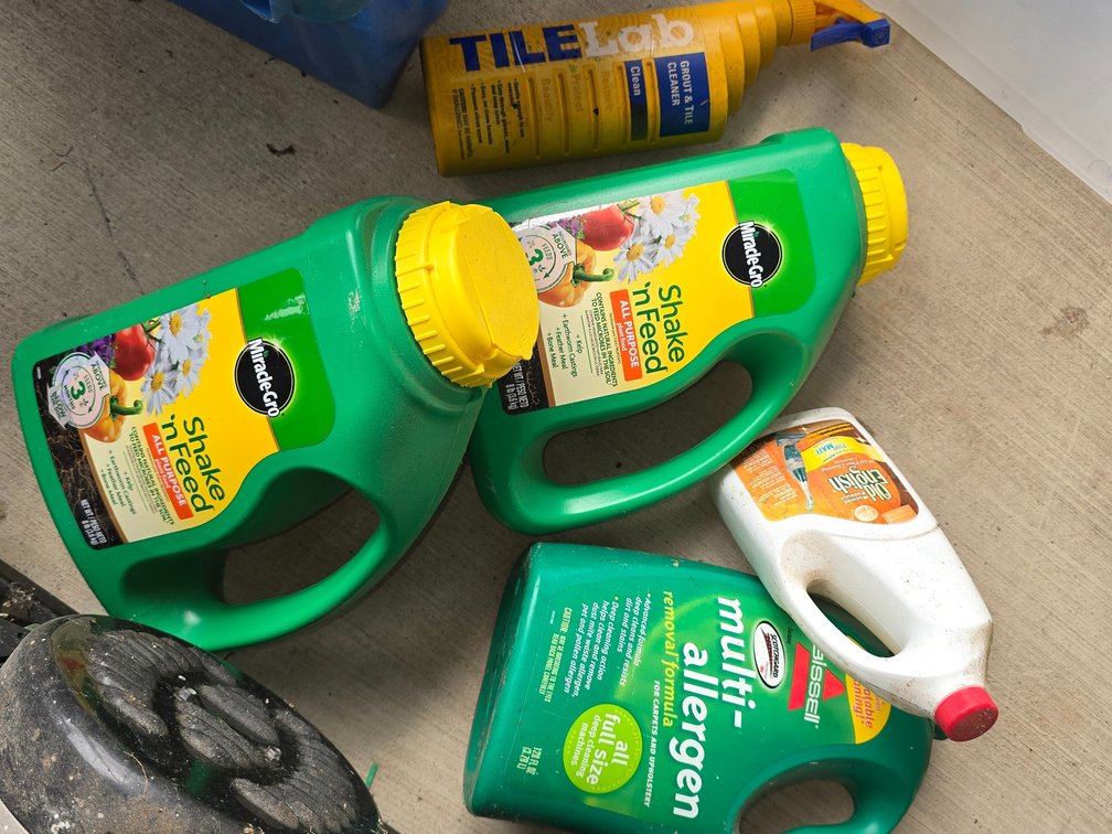 Tote of cleaners, plant feed, ect