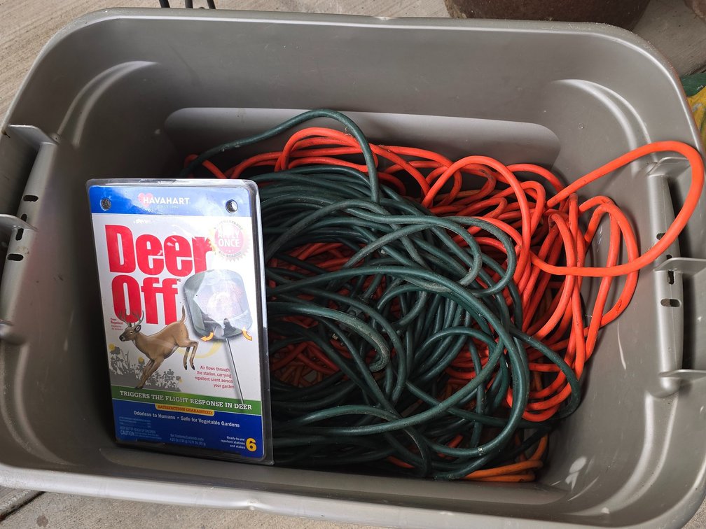 Tote with extension cords and deer off