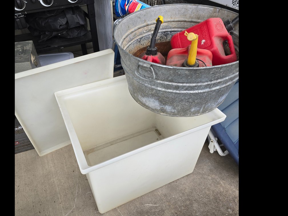 White tote, galvanized tub with gas cans