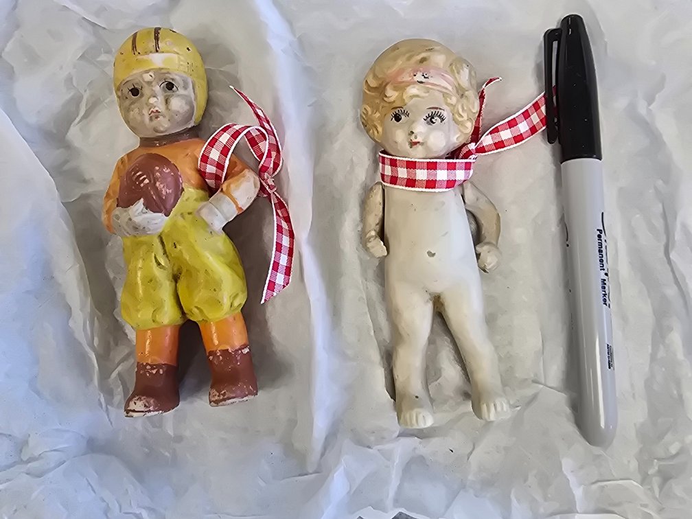 Two porcelain, small figurines, one is hand tied, made in japan