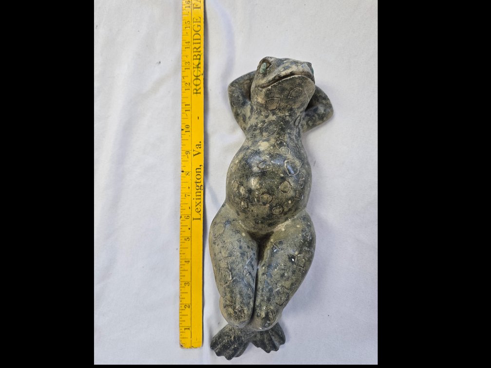 Carved stone frog reclining