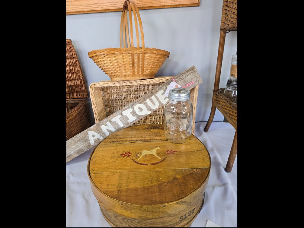 Wooden cheese box, antiques sign, baskets and metal jar lid 
