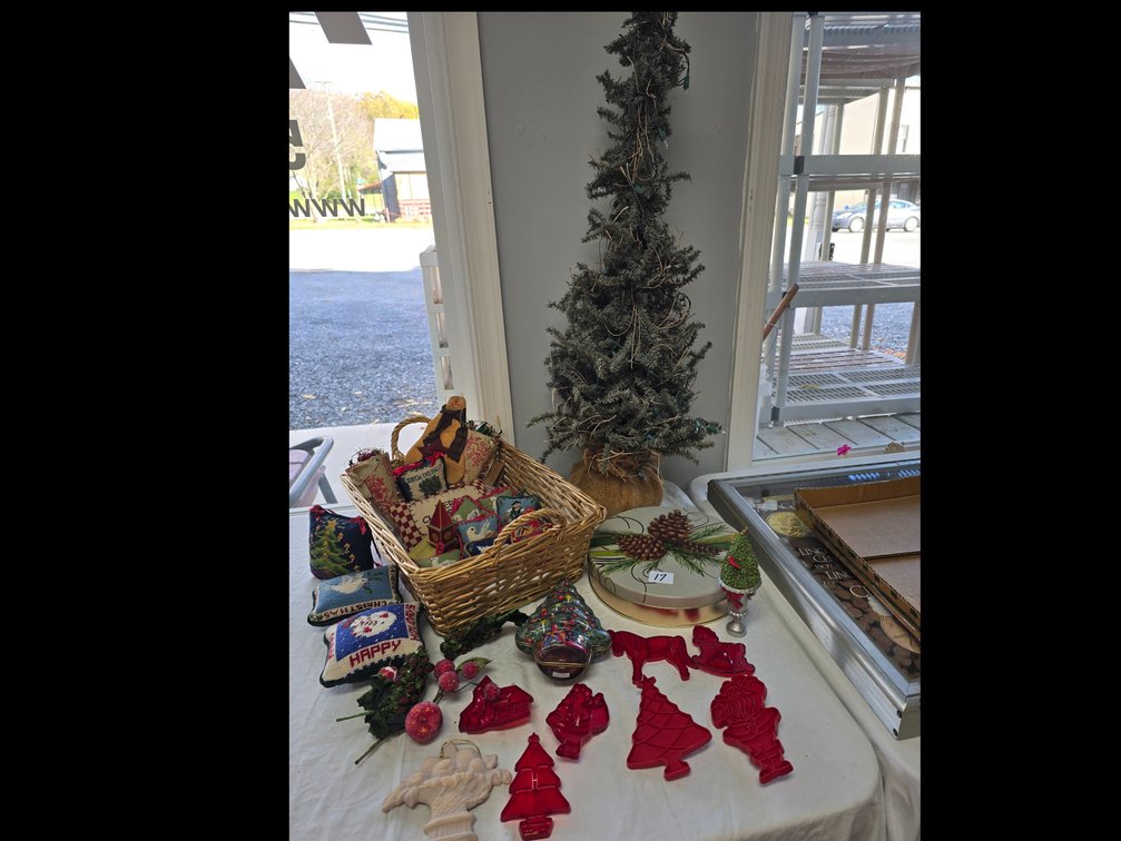 Primitive christmas tree with handmade crafted needlepoint ornaments, cookie cutters and holiday tins
