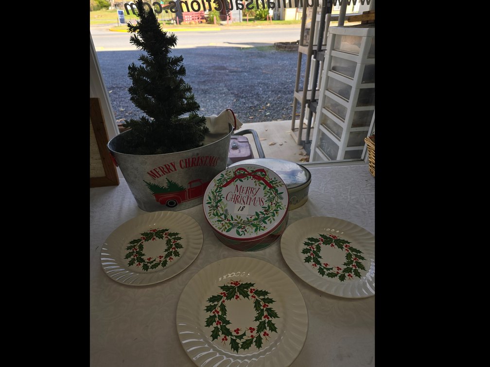 Christmas tub with tree included 3 holiday plates and 2 holiday tins.