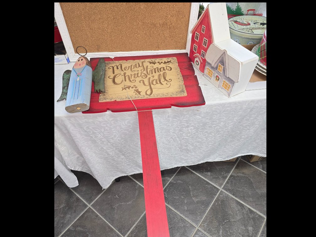 Primitive christmas sign hand painted angel with tin wings and wooden farmhousePrimitive Christmas sign hand painted angel with tin wings and wooden farmhouse.