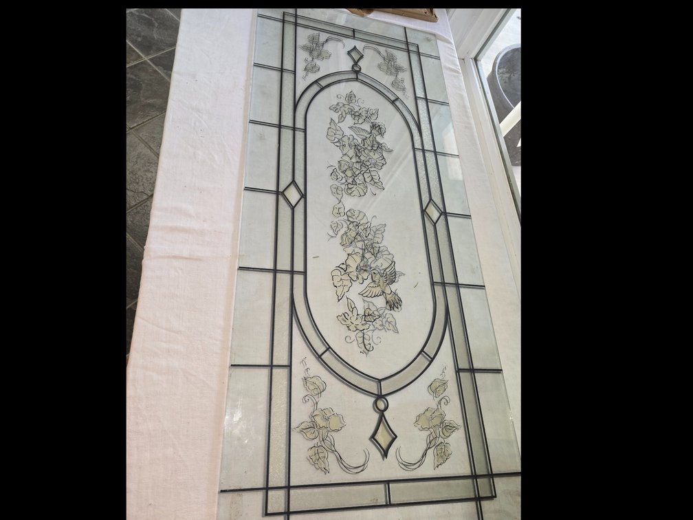 Two hummingbird glass panels