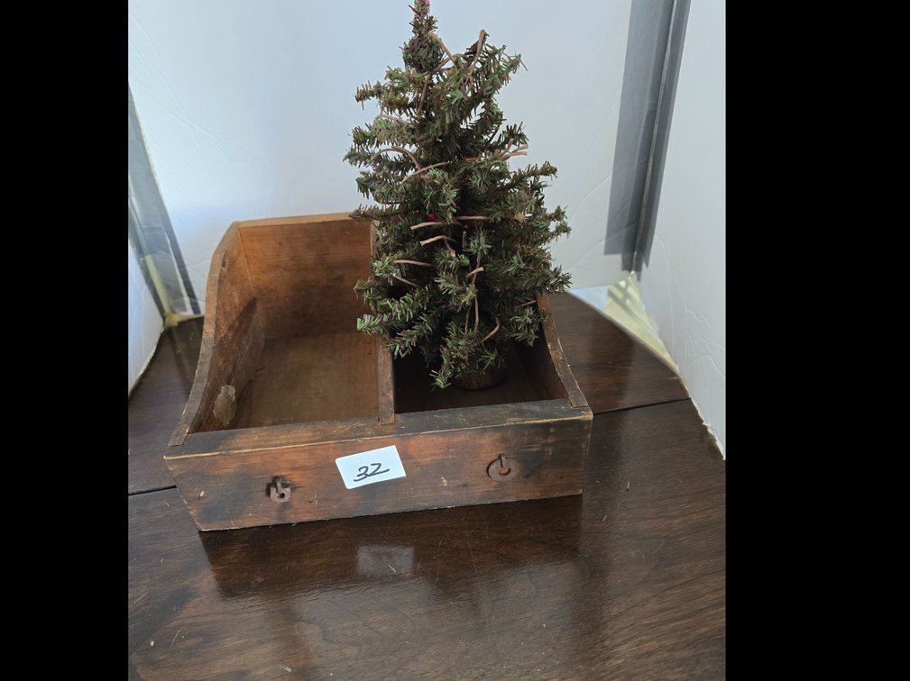 Very old vintage storage box with a primitive small tree