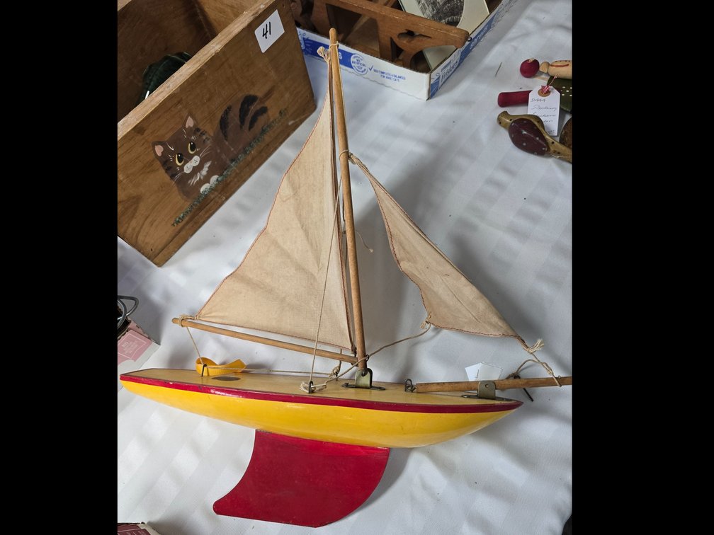 Wooden sail boat with cloth sail 