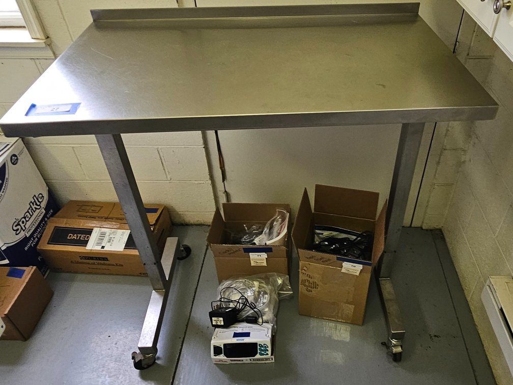 Stainless steel adjustable table