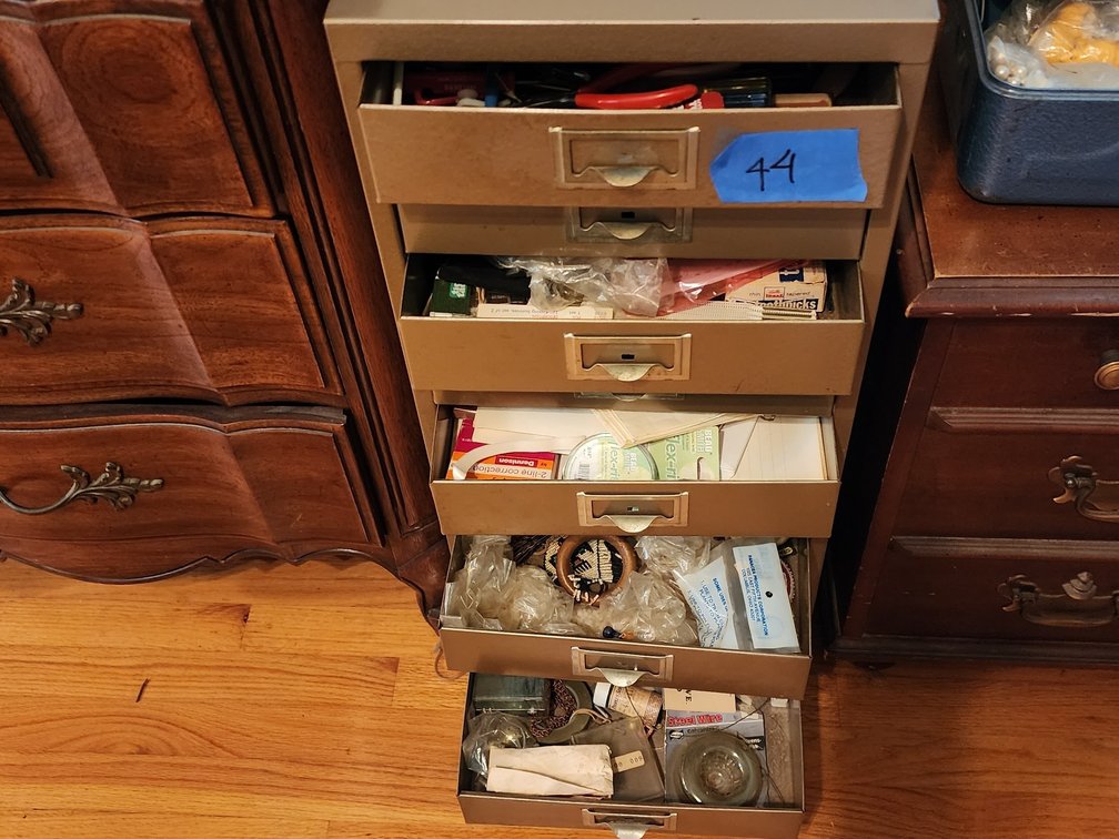 Metal cabinet with jewelry making supplies