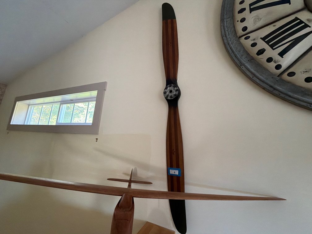 Vintage wooden airplane props and memorabilia