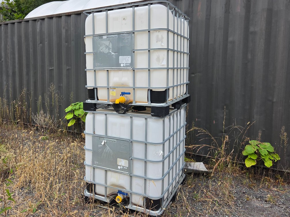 7  Bucktainer  frames, decorative rock, sprayer tank
