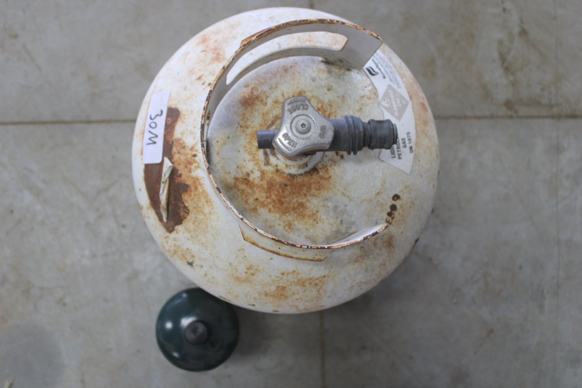 2 - Propane Tanks (1 larger cylinder, 1 smaller bottle)