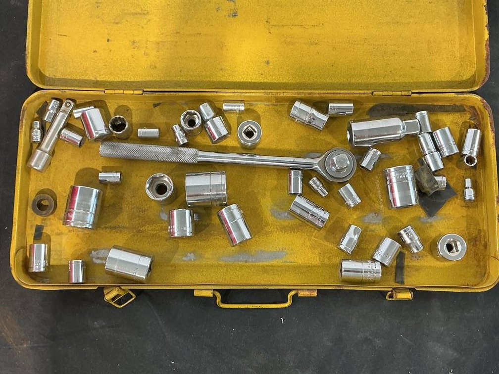 Yellow Metal Tool Box with Sockets and Ratchet Wrench