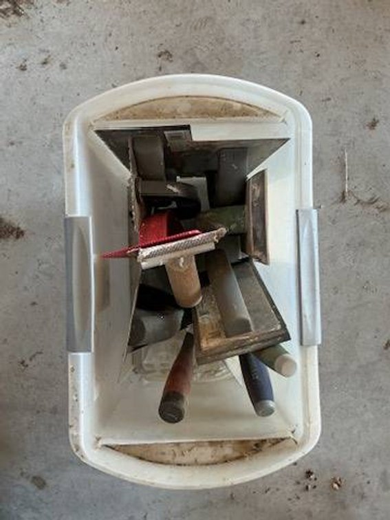 Tote of Drywall Trowels